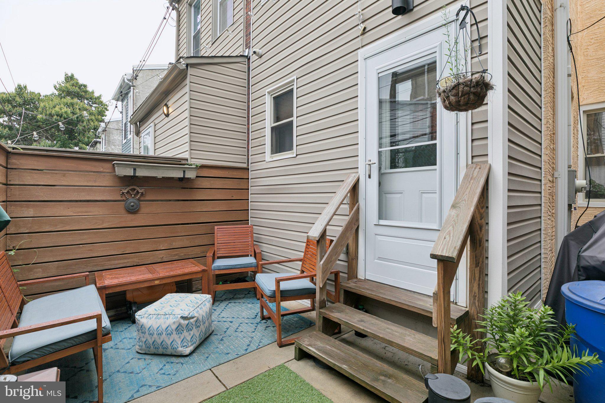 1314 North Dover Street Philadelphia, PA 19121 - Photo 29 of 30 a view of a house with a chairs in patio