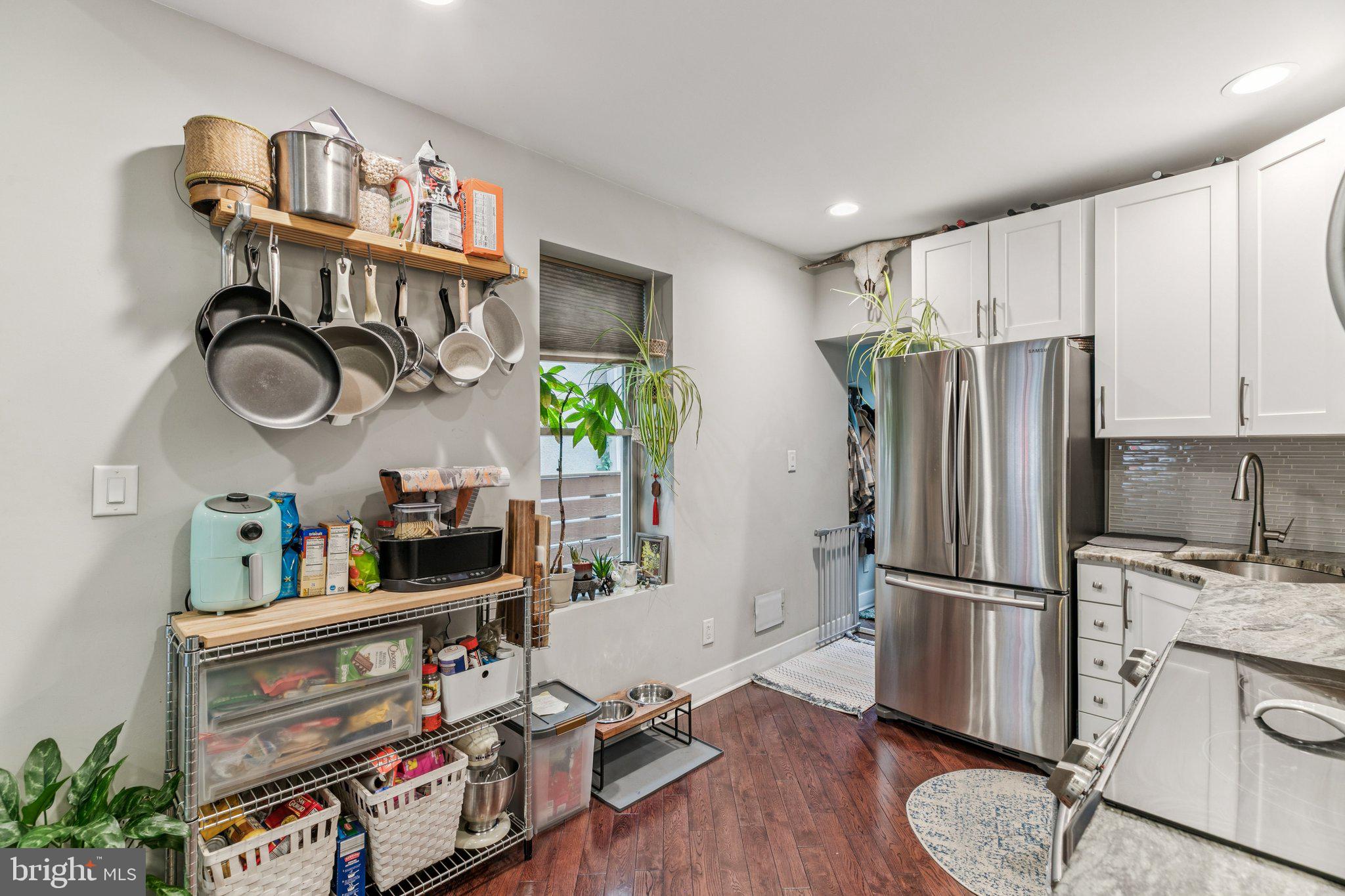 1314 North Dover Street Philadelphia, PA 19121 - Photo 10 of 30 a kitchen with stainless steel appliances granite countertop a refrigerator and a stove top oven