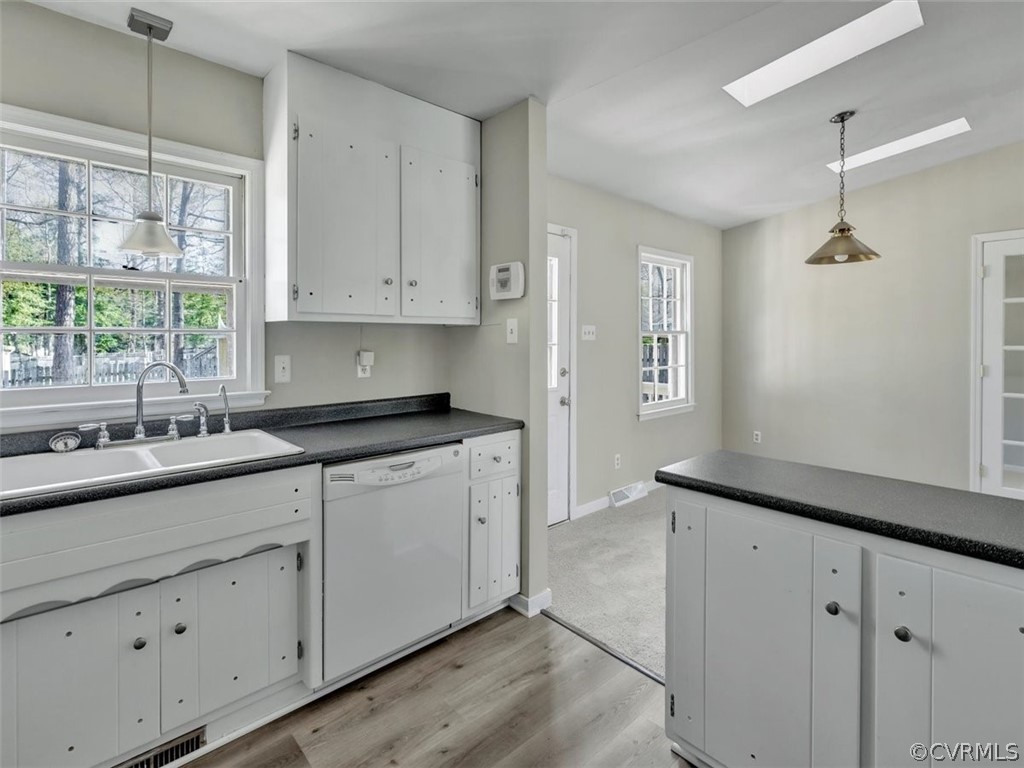 10506 Ridgerun Road Chesterfield, VA 23832 - Photo 14 of 25 a kitchen with a sink window and cabinets