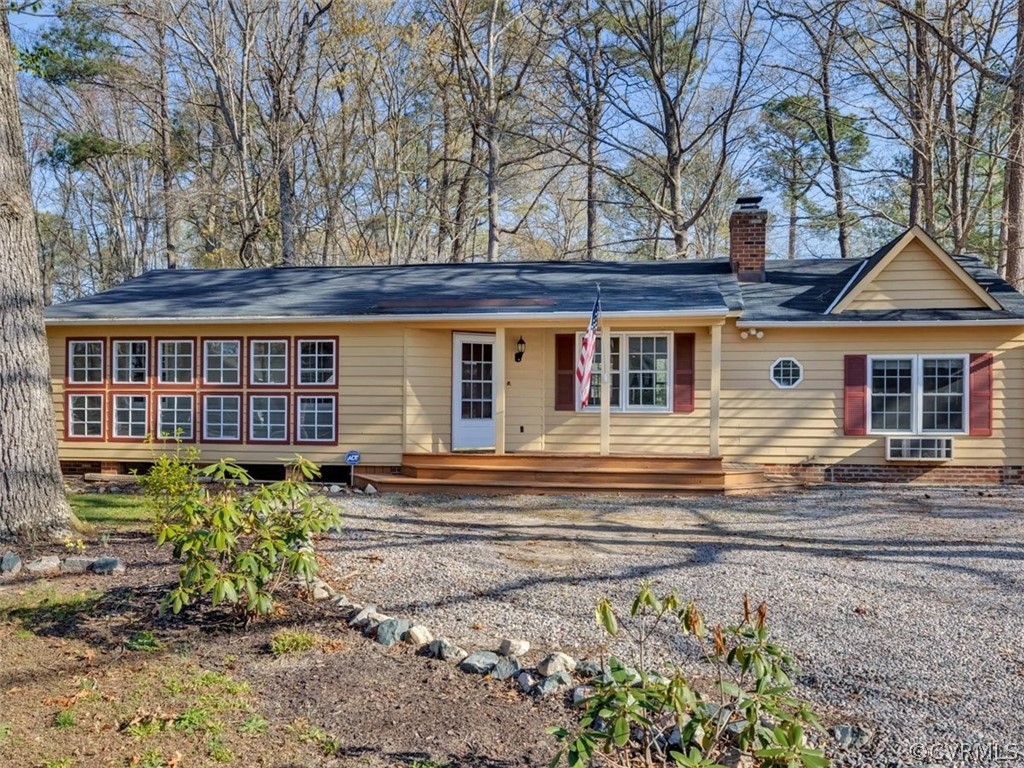 10506 Ridgerun Road Chesterfield, VA 23832 - Photo 2 of 25 a front view of a house with a garden