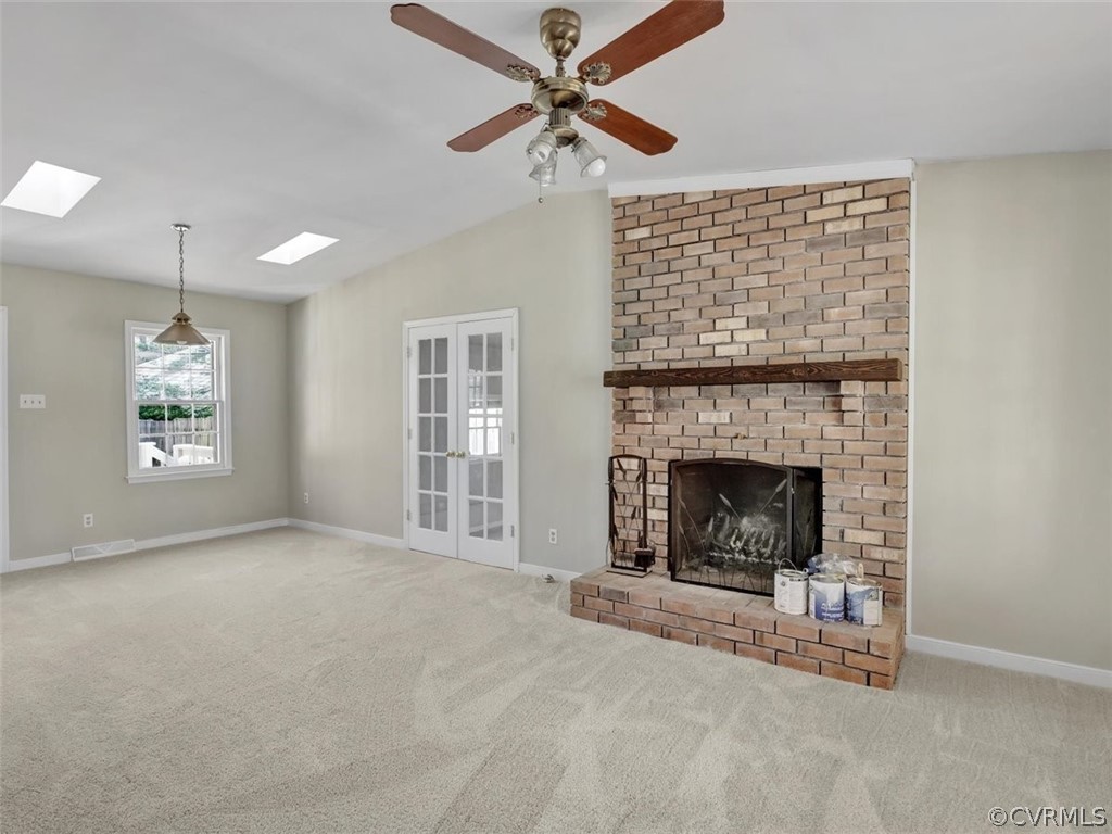 10506 Ridgerun Road Chesterfield, VA 23832 - Photo 3 of 25 a view of a livingroom with a fireplace and a chandelier fan
