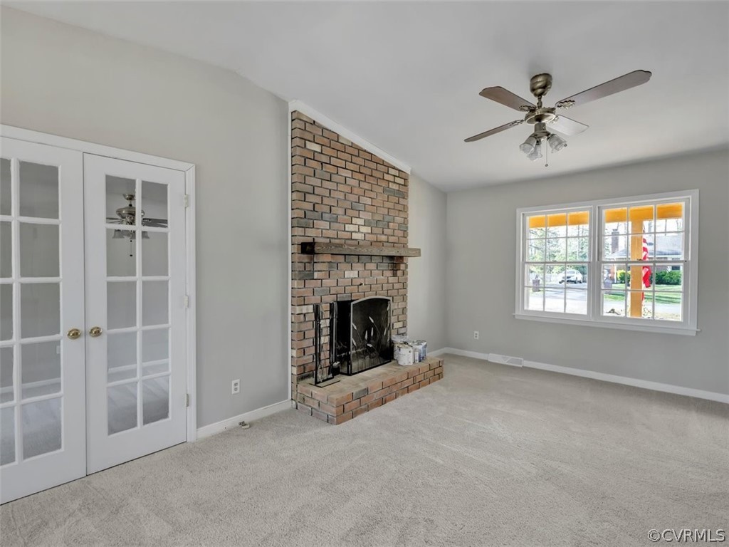 10506 Ridgerun Road Chesterfield, VA 23832 - Photo 5 of 25 a view of a livingroom with a fireplace and windows