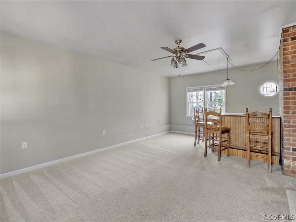 10506 Ridgerun Road Chesterfield, VA 23832 - Photo 8 of 25 a view of a livingroom with furniture and a ceiling fan