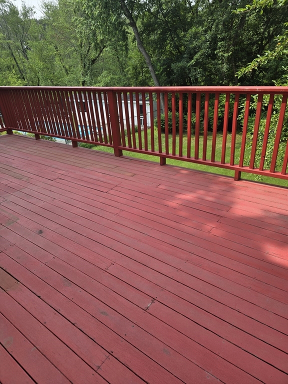 150 Grove Street Reading, MA 01867 - Photo 12 of 20 a view of deck with wooden floor