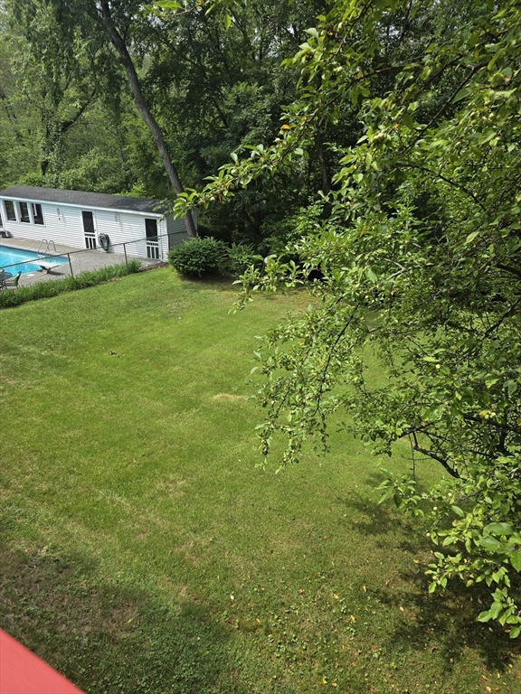 150 Grove Street Reading, MA 01867 - Photo 13 of 20 a view of house with yard and sitting area