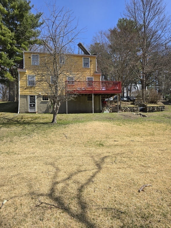 150 Grove Street Reading, MA 01867 - Photo 19 of 20 a view of a swimming pool with a house in the background