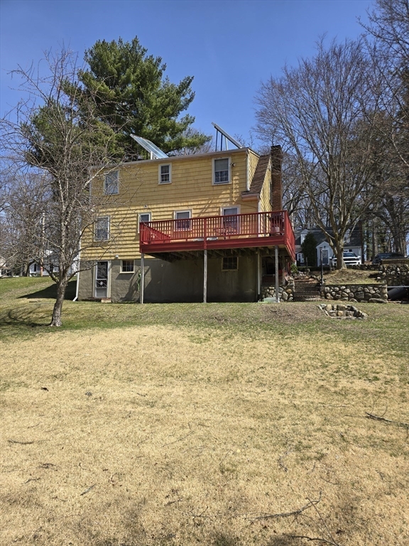 150 Grove Street Reading, MA 01867 - Photo 20 of 20 a front view of a building with a yard