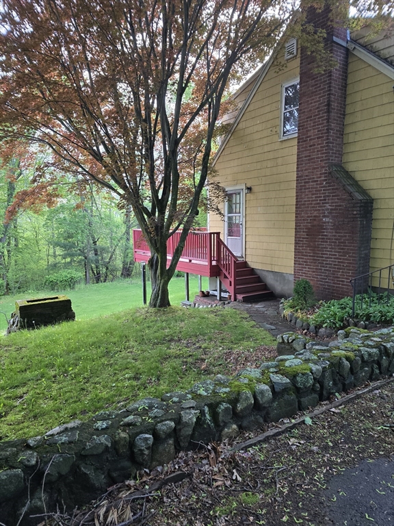150 Grove Street Reading, MA 01867 - Photo 4 of 20 a view of a house with a backyard