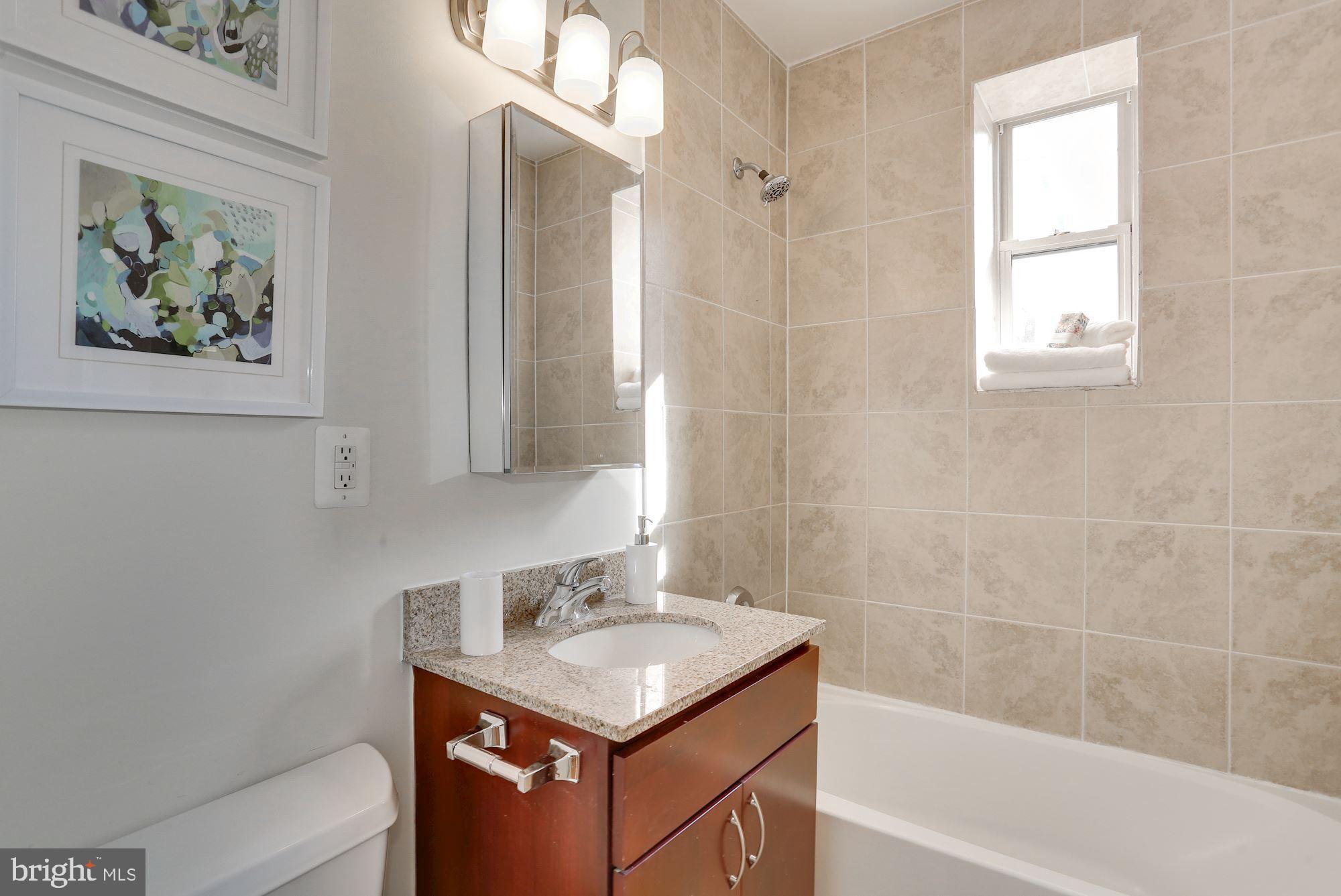 5403 9th Street Northwest, Unit 204 Washington, DC 20011 - Photo 26 of 27 Updated and sunny bathroom!