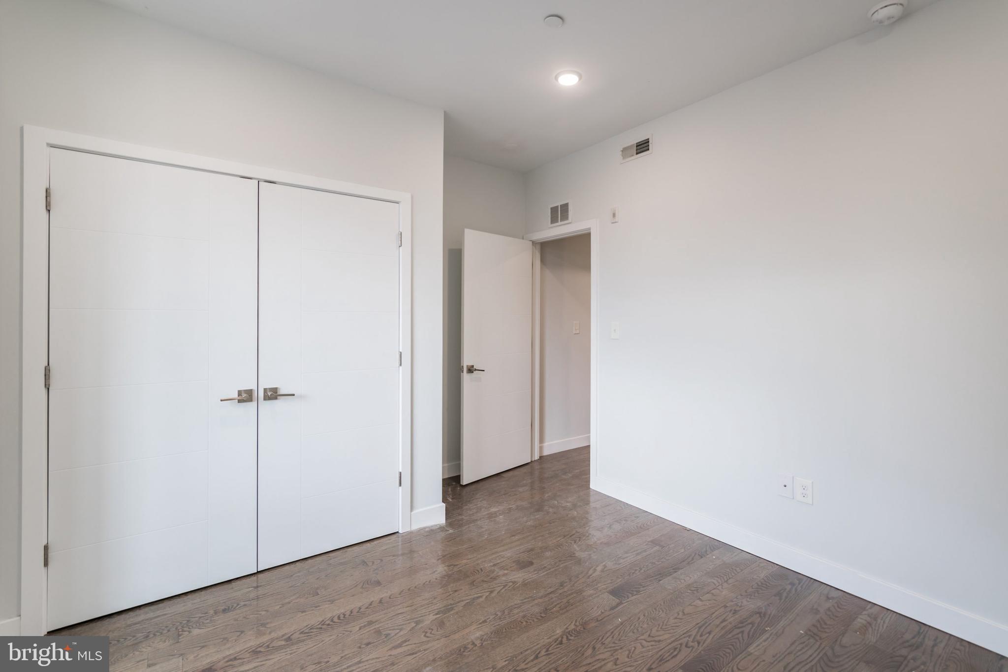 627 West Oxford Street, Unit 2 Philadelphia, PA 19122 - Photo 12 of 14 a view of a hallway with wooden floor