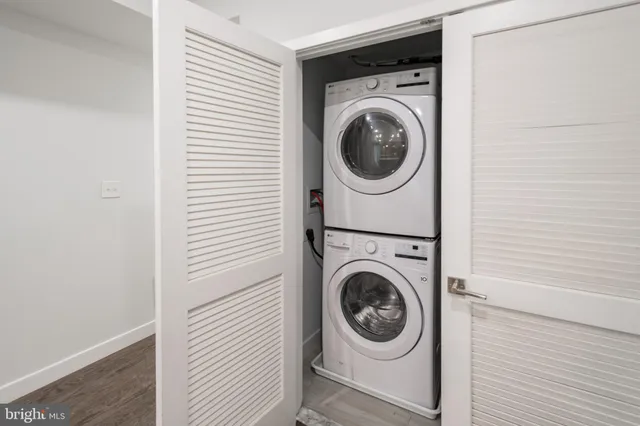 a view of a hallway with washer and dryer