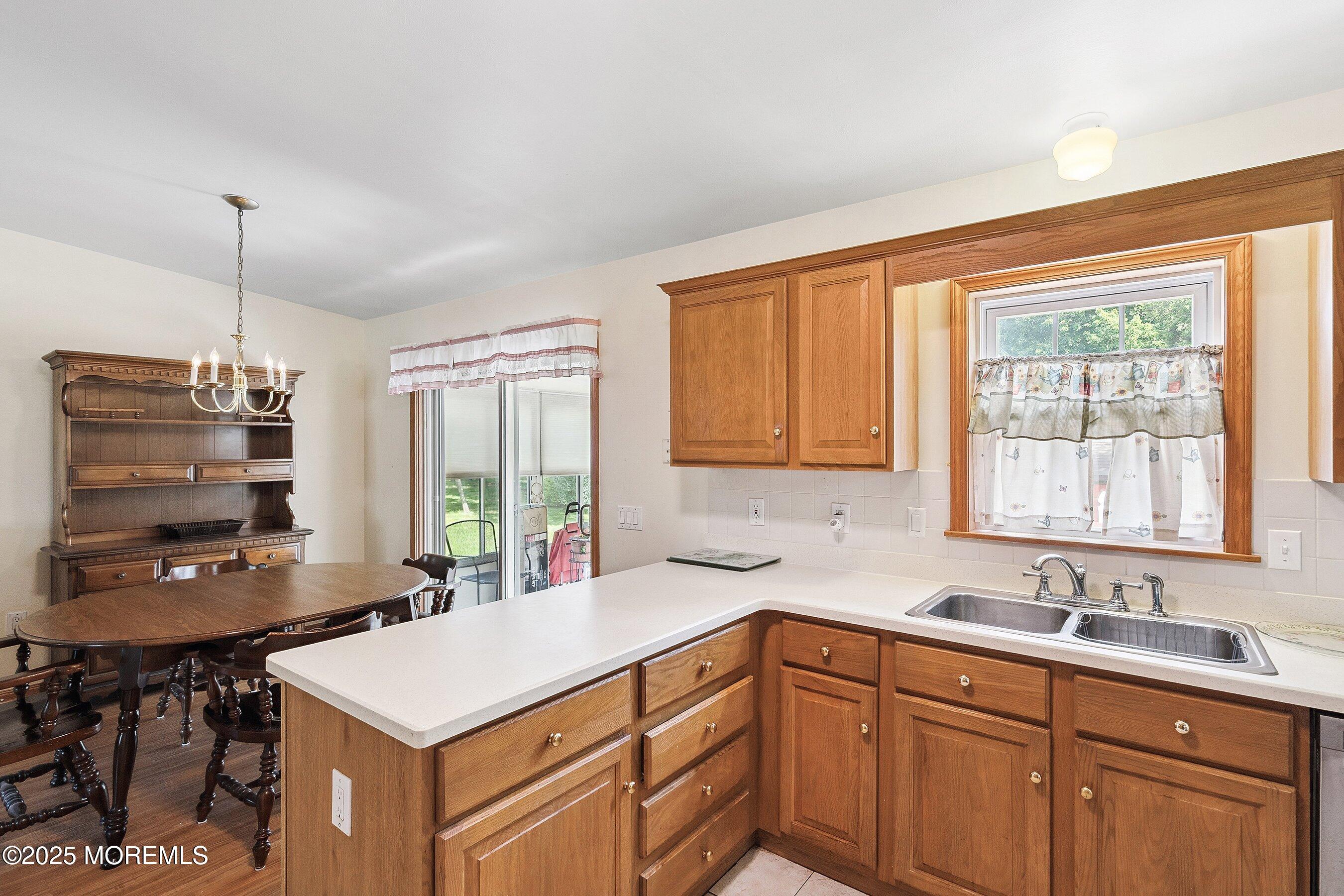 12 Copperfield Drive Cream Ridge, NJ 08514 - Photo 13 of 33 a kitchen with a sink a window and appliances