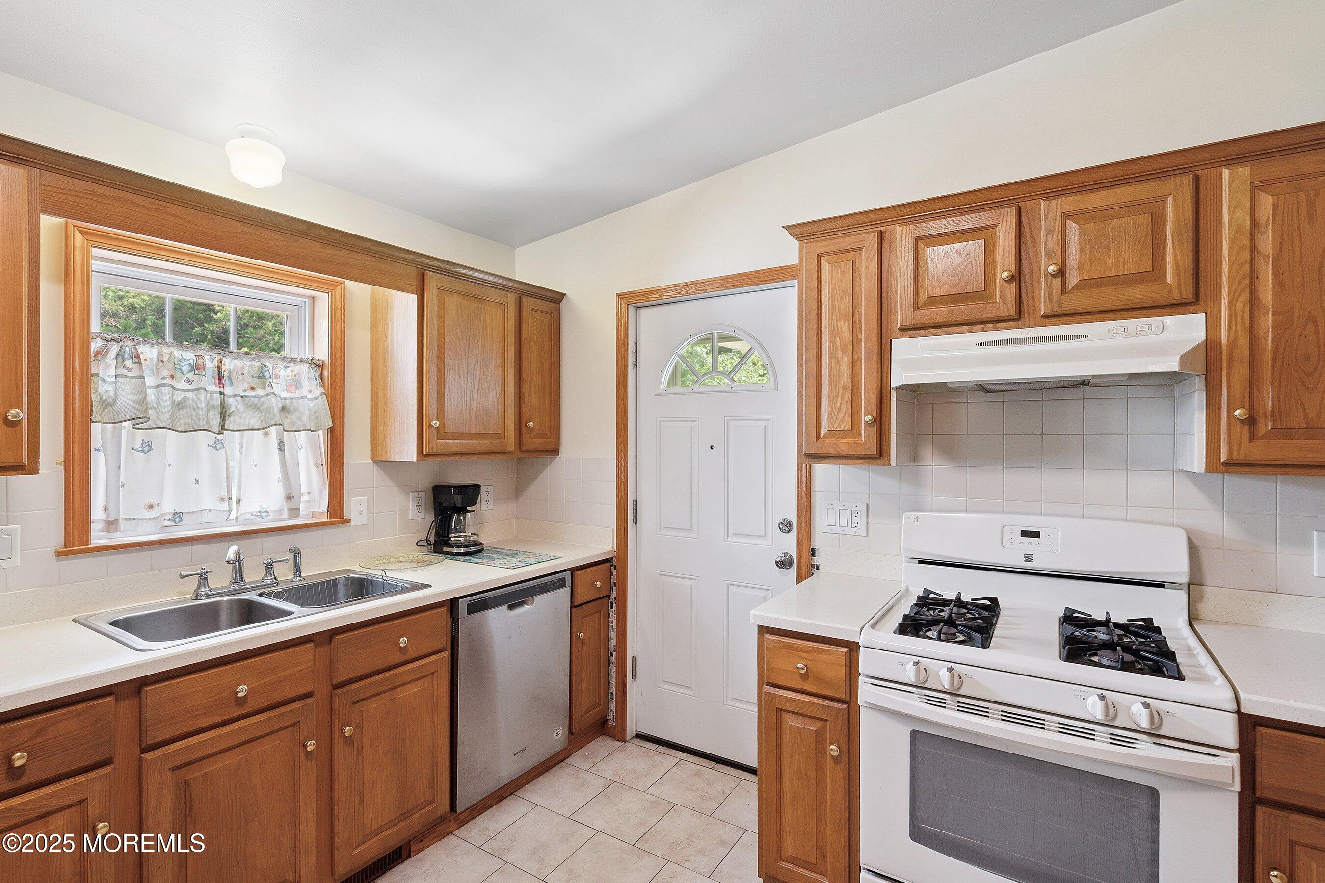 12 Copperfield Drive Cream Ridge, NJ 08514 - Photo 14 of 33 a kitchen with a stove a sink and a window
