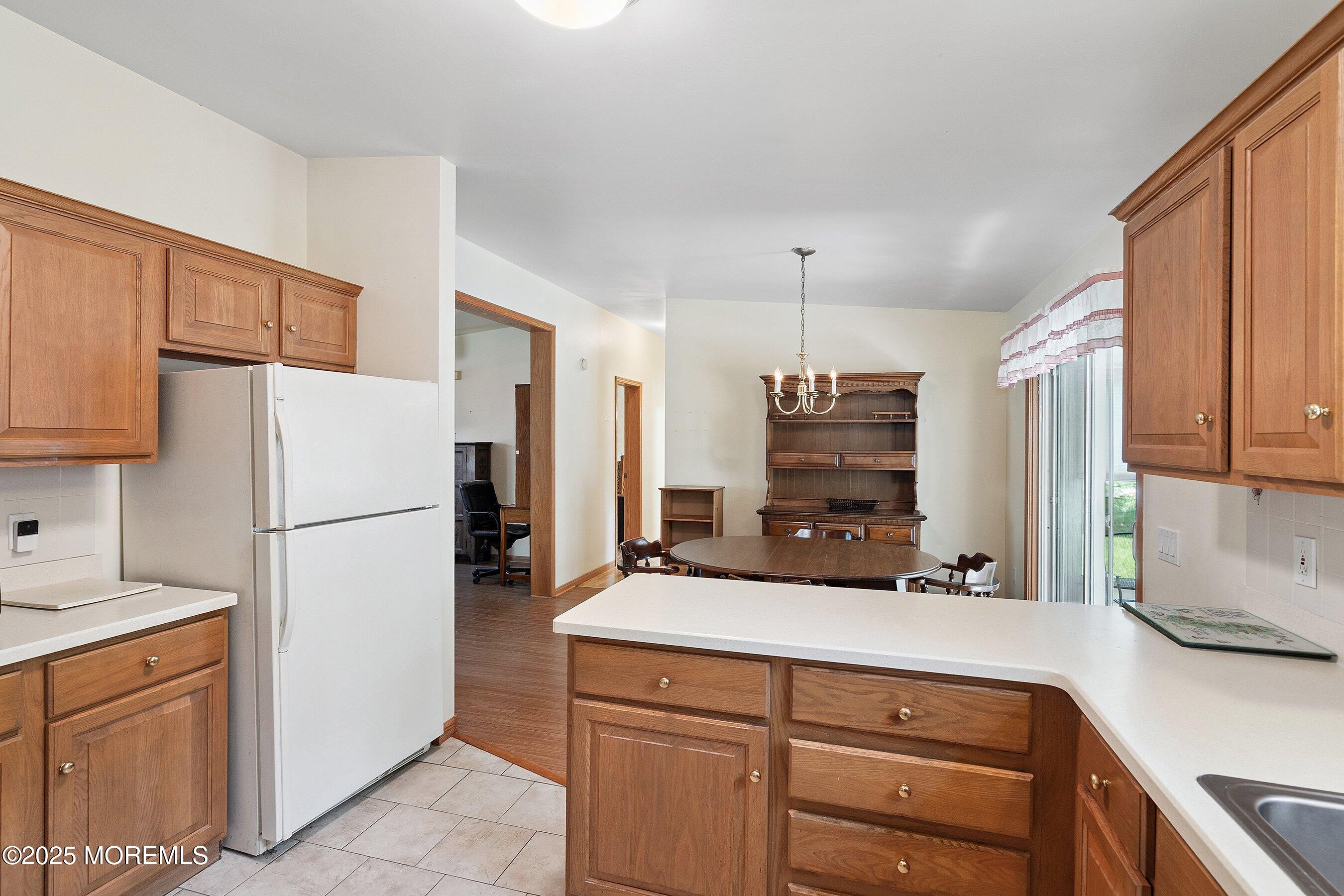 12 Copperfield Drive Cream Ridge, NJ 08514 - Photo 15 of 33 a kitchen with a refrigerator and a sink