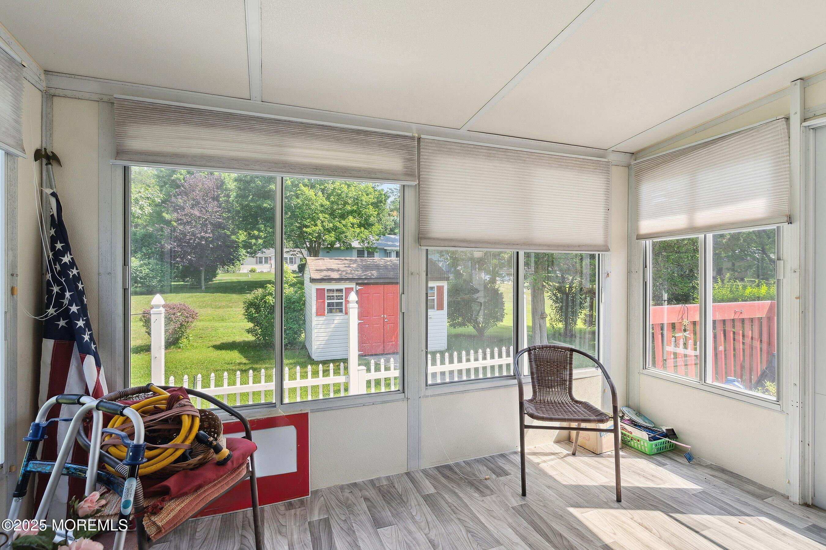 12 Copperfield Drive Cream Ridge, NJ 08514 - Photo 18 of 33 a living room with furniture and a floor to ceiling window
