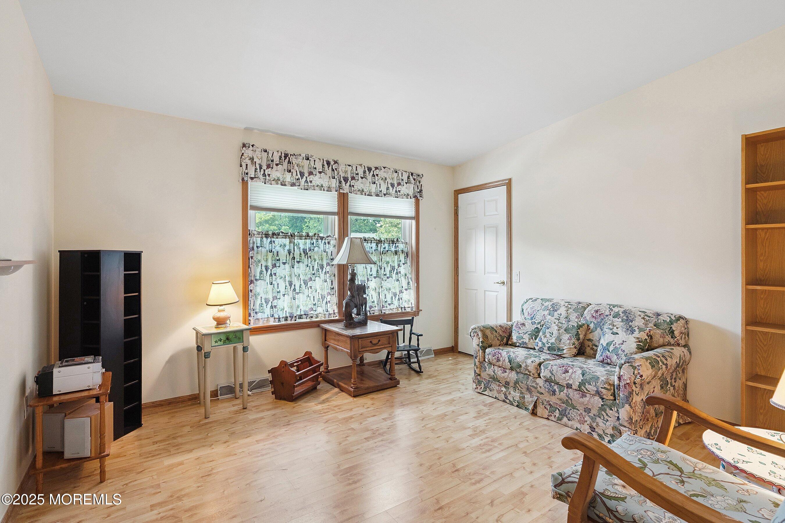 12 Copperfield Drive Cream Ridge, NJ 08514 - Photo 23 of 33 a living room with furniture and a flat screen tv