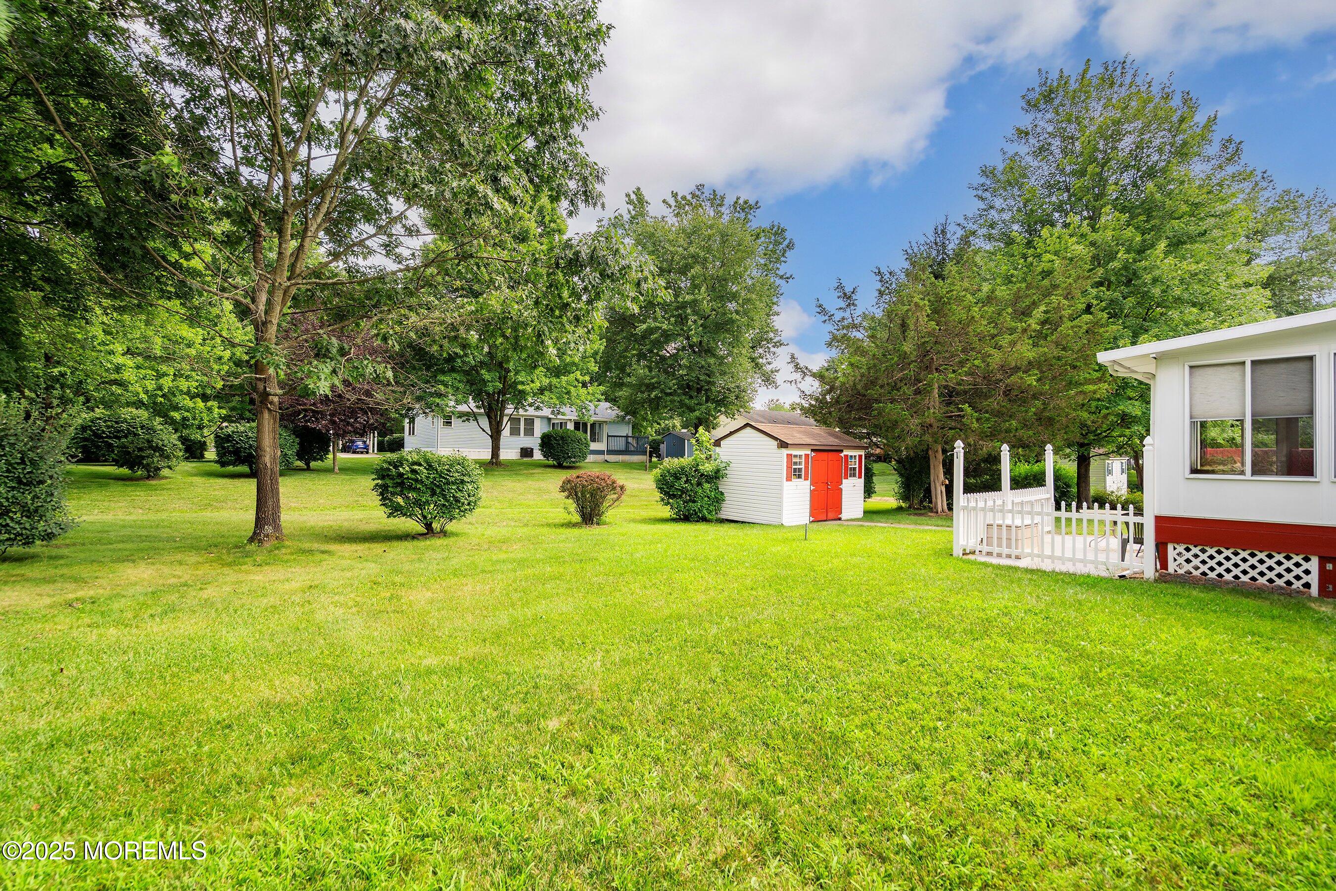 12 Copperfield Drive Cream Ridge, NJ 08514 - Photo 26 of 33 a front view of a house with a yard and trees