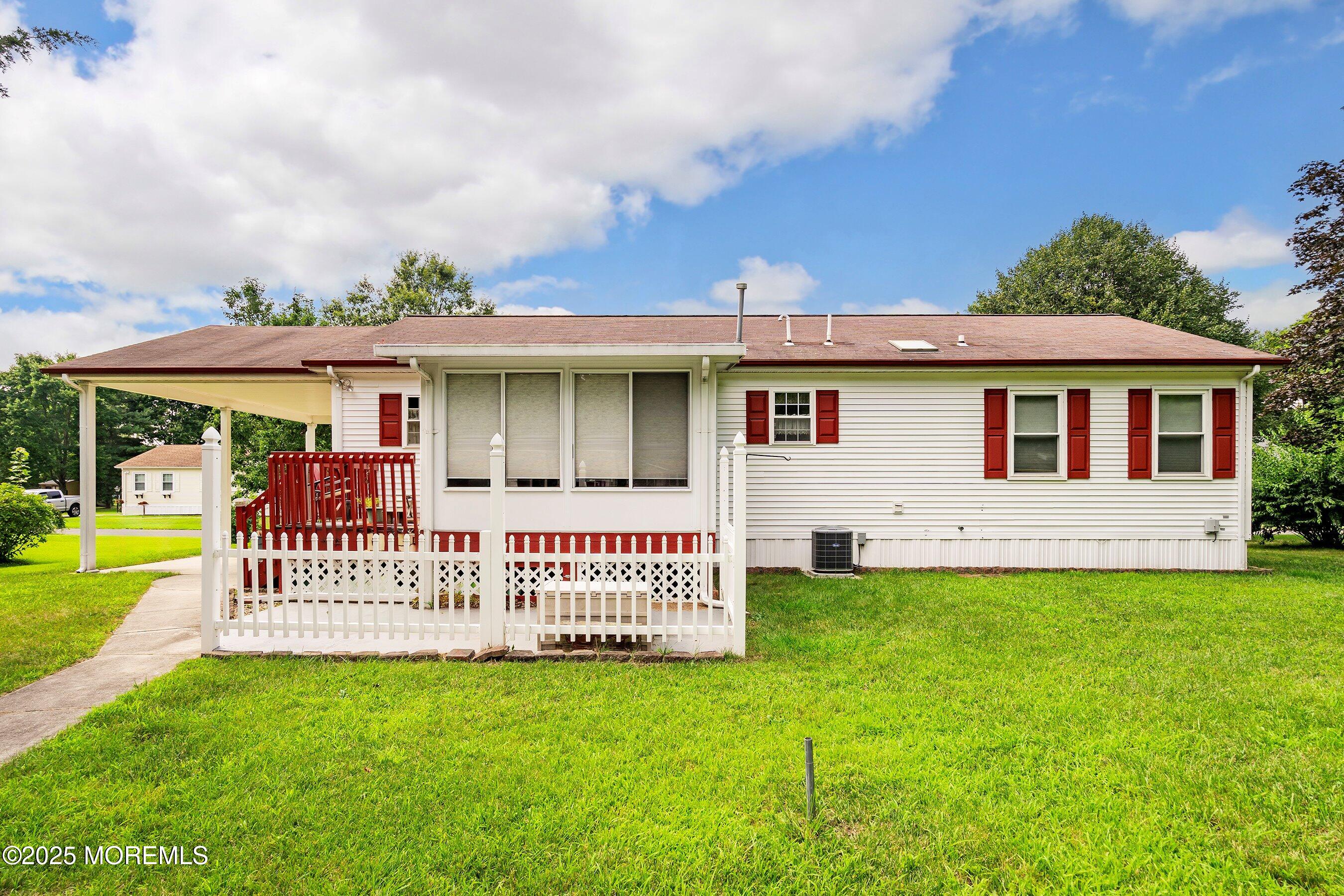 12 Copperfield Drive Cream Ridge, NJ 08514 - Photo 27 of 33 a front view of a house with a garden