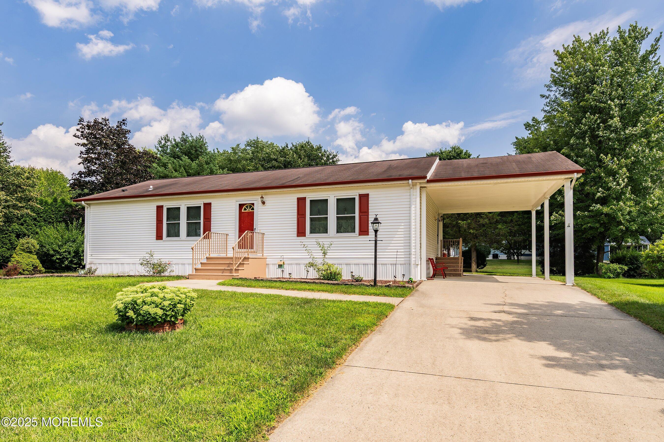 12 Copperfield Drive Cream Ridge, NJ 08514 - Photo 3 of 33 a front view of house with a garden and patio