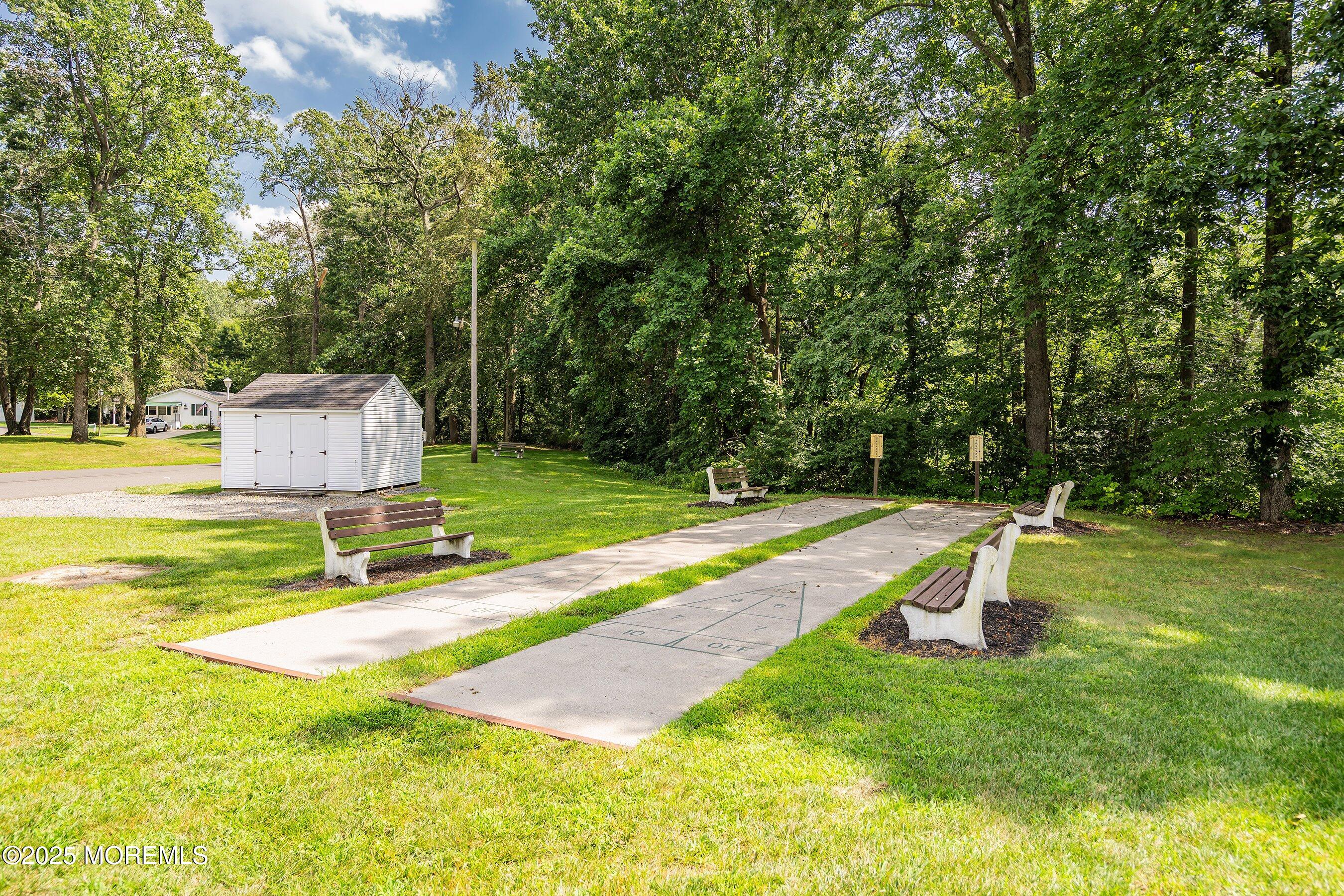 12 Copperfield Drive Cream Ridge, NJ 08514 - Photo 32 of 33 a view of a swimming pool with a patio and a yard