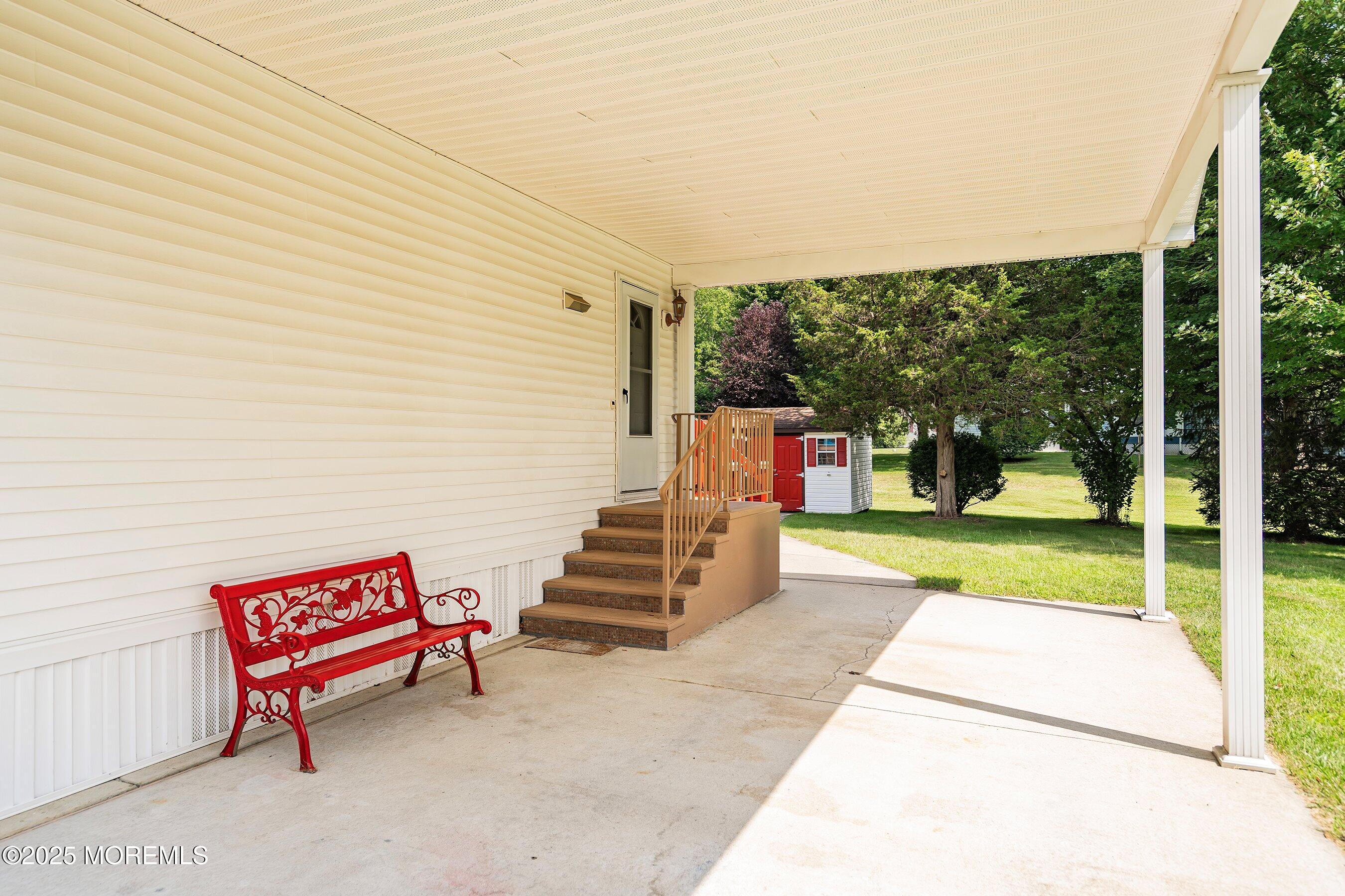 12 Copperfield Drive Cream Ridge, NJ 08514 - Photo 4 of 33 a view of a patio with table and chairs and floor to ceiling window
