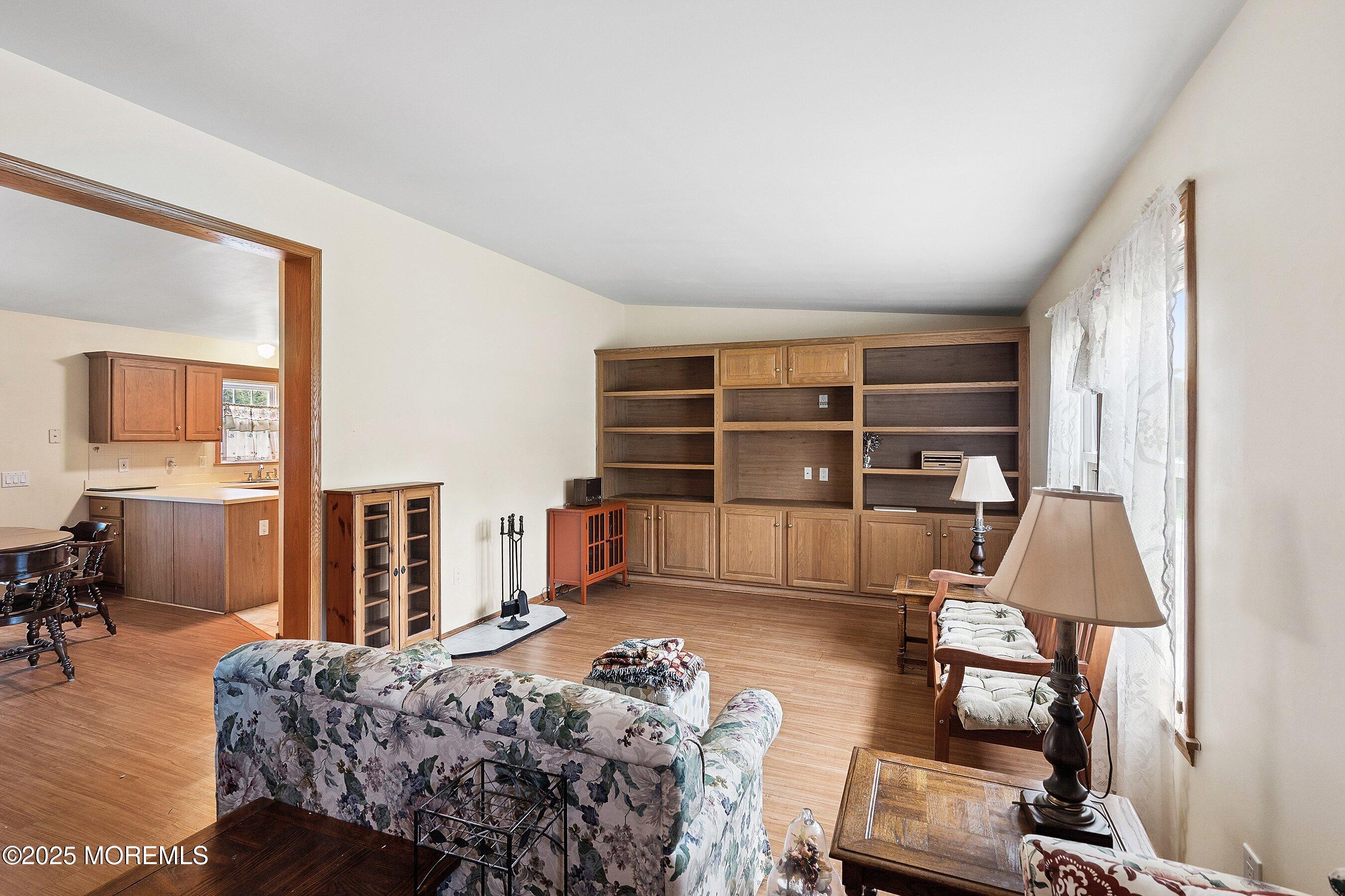 12 Copperfield Drive Cream Ridge, NJ 08514 - Photo 5 of 33 a living room with furniture a rug and a flat screen tv