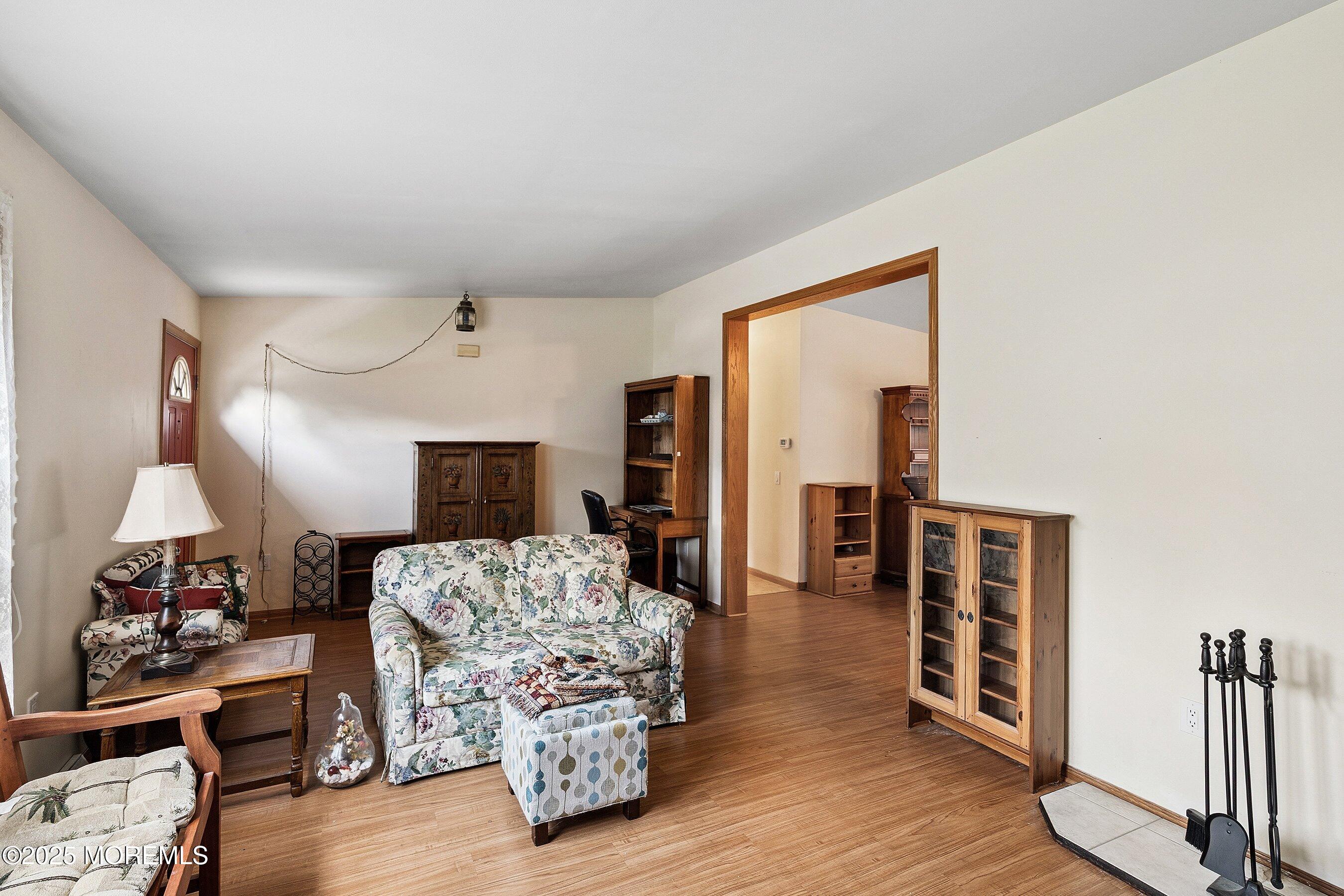 12 Copperfield Drive Cream Ridge, NJ 08514 - Photo 9 of 33 a living room with furniture and a wooden floor