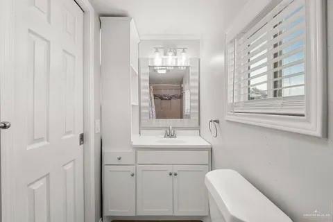 35619 General Brant Road Rio Hondo, TX 78583 - Photo 21 of 21 a bathroom with a toilet sink and mirror