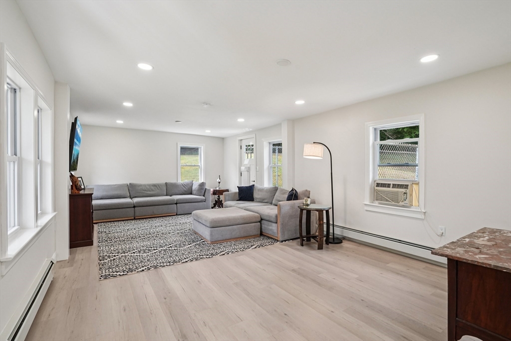 44 Richardson Corner Road Charlton, MA 01507 - Photo 12 of 31 a living room with furniture wooden floor and a window