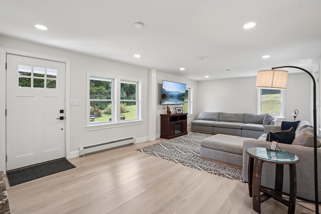 44 Richardson Corner Road Charlton, MA 01507 - Photo 13 of 31 a living room with furniture and a window