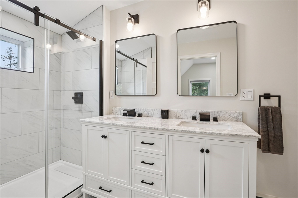 44 Richardson Corner Road Charlton, MA 01507 - Photo 18 of 31 a bathroom with a sink vanity granite shower and a mirror
