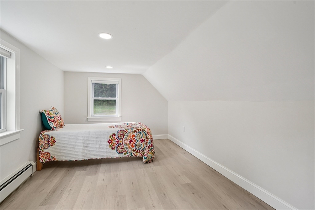44 Richardson Corner Road Charlton, MA 01507 - Photo 20 of 31 a bedroom with a bed and a window