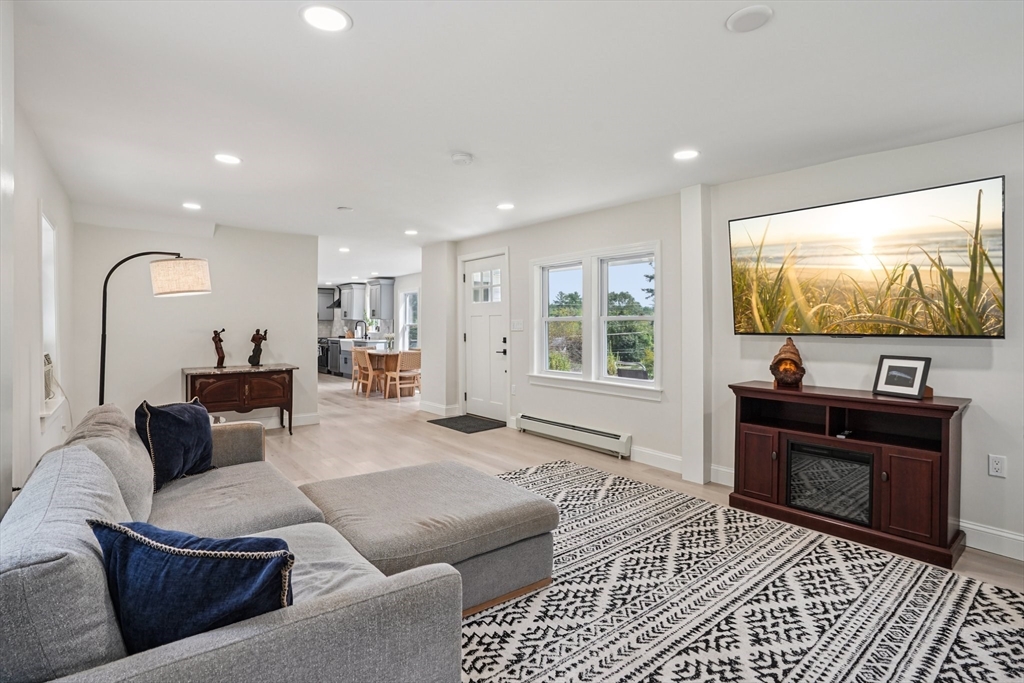 44 Richardson Corner Road Charlton, MA 01507 - Photo 2 of 31 a living room with furniture and a flat screen tv