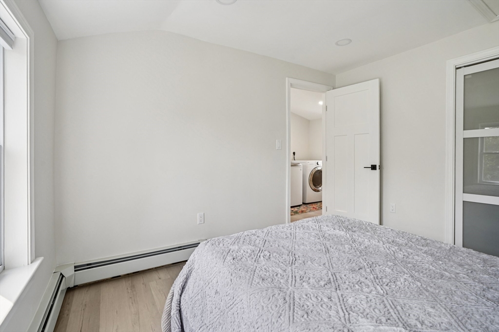 44 Richardson Corner Road Charlton, MA 01507 - Photo 23 of 31 a bedroom with a bed and a mirror