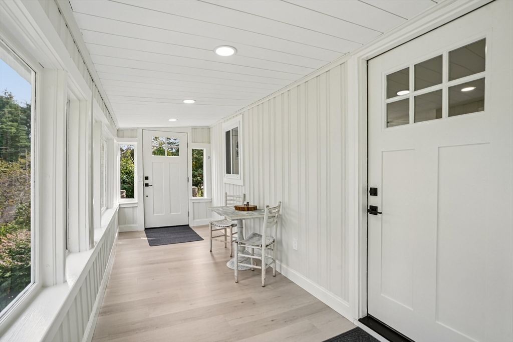 44 Richardson Corner Road Charlton, MA 01507 - Photo 27 of 31 a view of a hallway with wooden floor and dining room