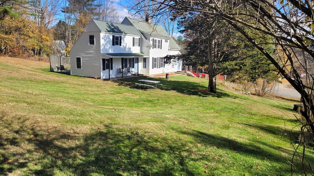 44 Richardson Corner Road Charlton, MA 01507 - Photo 28 of 31 a view of an house with backyard and tree