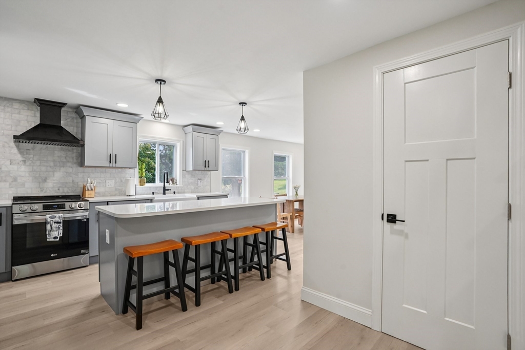44 Richardson Corner Road Charlton, MA 01507 - Photo 8 of 31 a large kitchen with a table and chairs in it