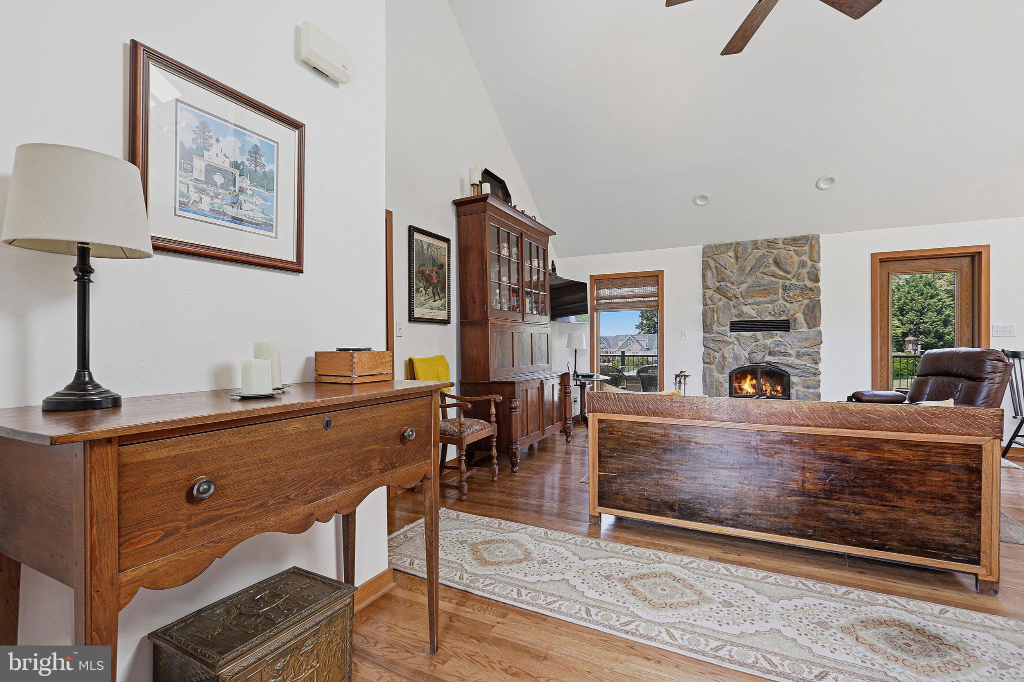 6495 Tides Road King George, VA 22485 - Photo 6 of 65 a living room with furniture a fireplace and a flat screen tv