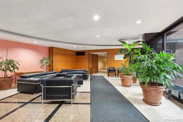 a utility room with stainless steel appliances wooden floors and stove