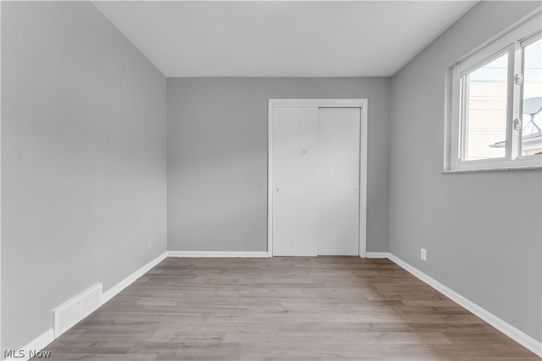 2915 Snow Road, Unit 2/UP Cleveland, OH 44134 - Photo 10 of 23 Neutral grey walls complemented by wood-finish flooring