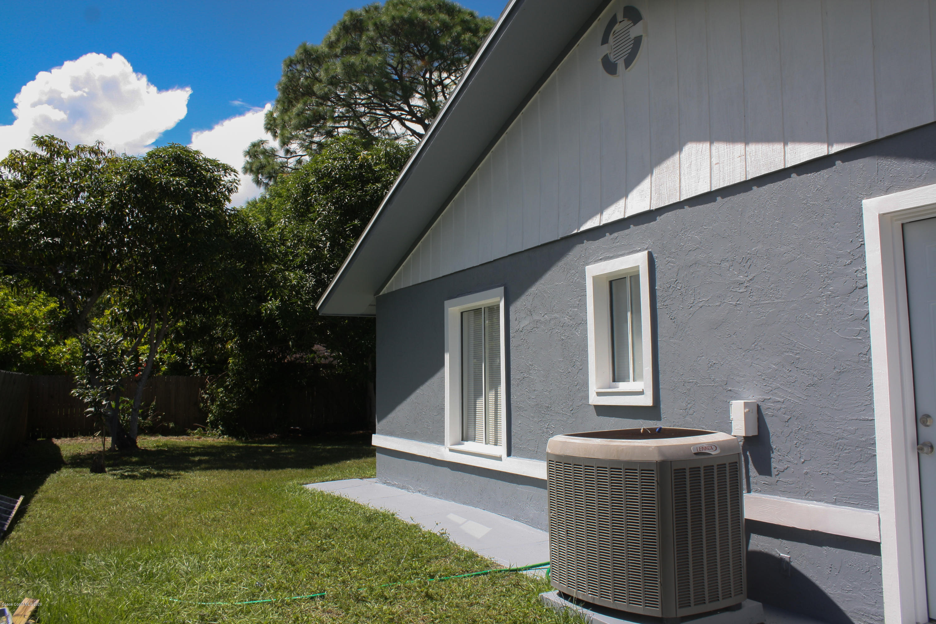 326 Riley Avenue Northeast Palm Bay, FL 32907 - Photo 31 of 43 a backyard of a house with seating space