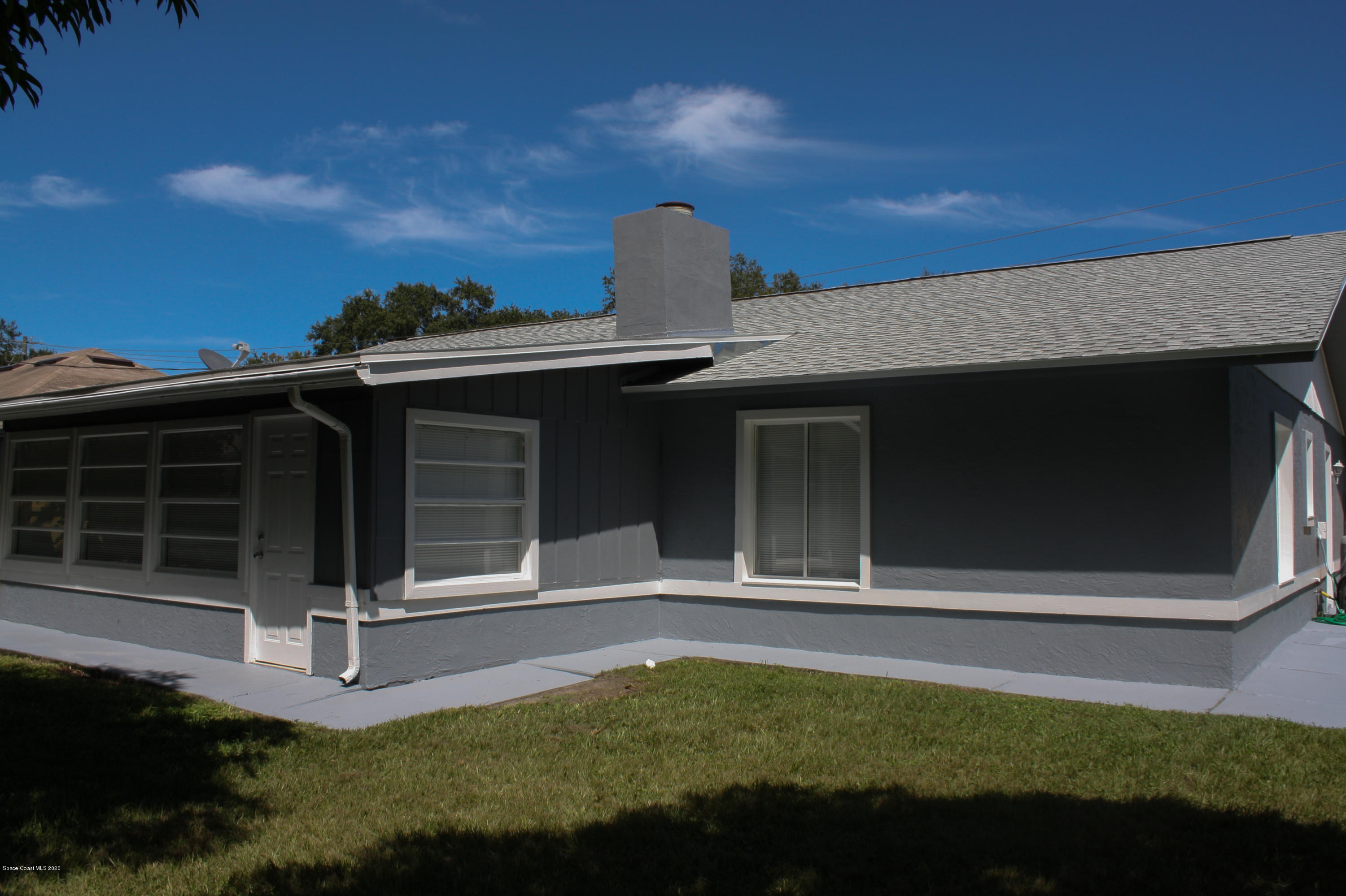 326 Riley Avenue Northeast Palm Bay, FL 32907 - Photo 37 of 43 a view of a house with a small yard