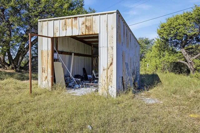 a view of a big yard with a house
