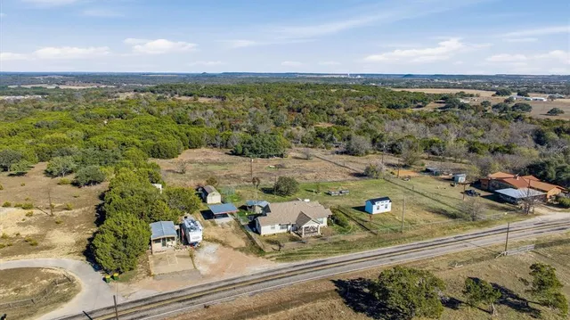 an aerial view of residential house with parking space