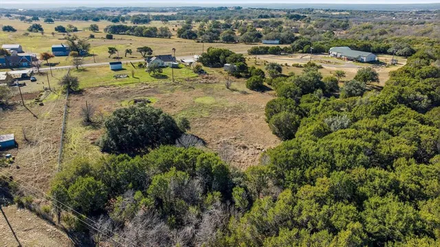 an aerial view of a houses with outdoor space