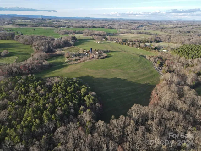 a view of a field with an ocean