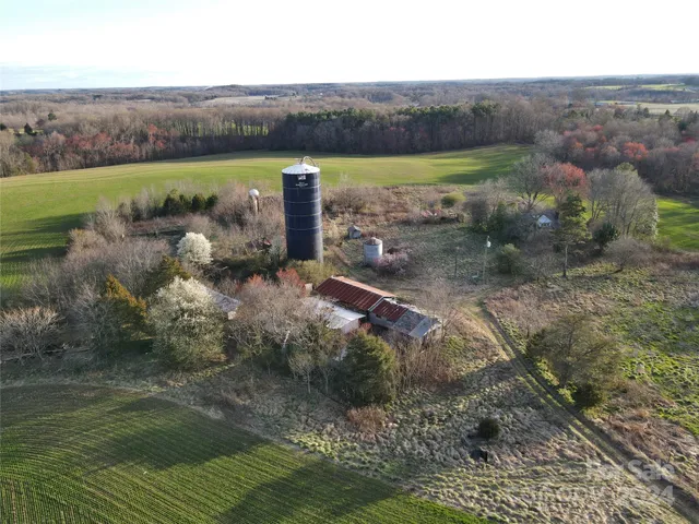 a view of a back yard of the house and a yard