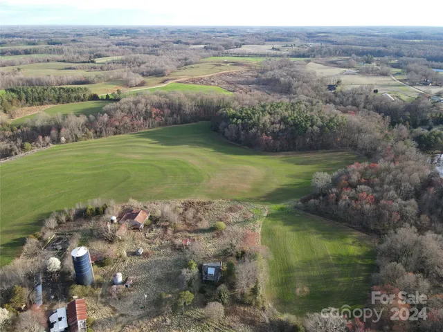 an aerial view of a golf course with parking space