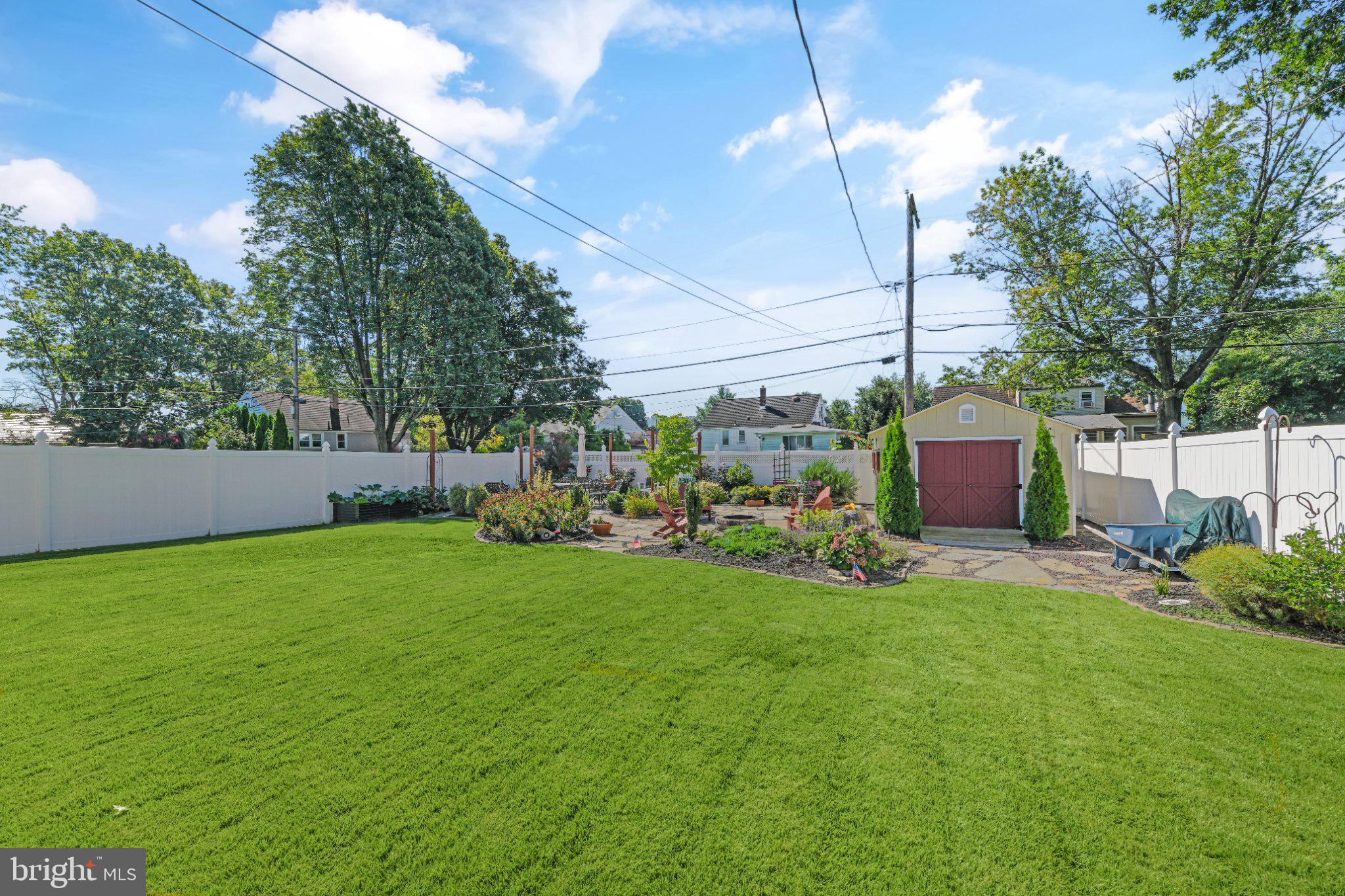 524 Harding Avenue Shillington, PA 19607 - Photo 32 of 37 Lush green oasis with vibrant gardens.