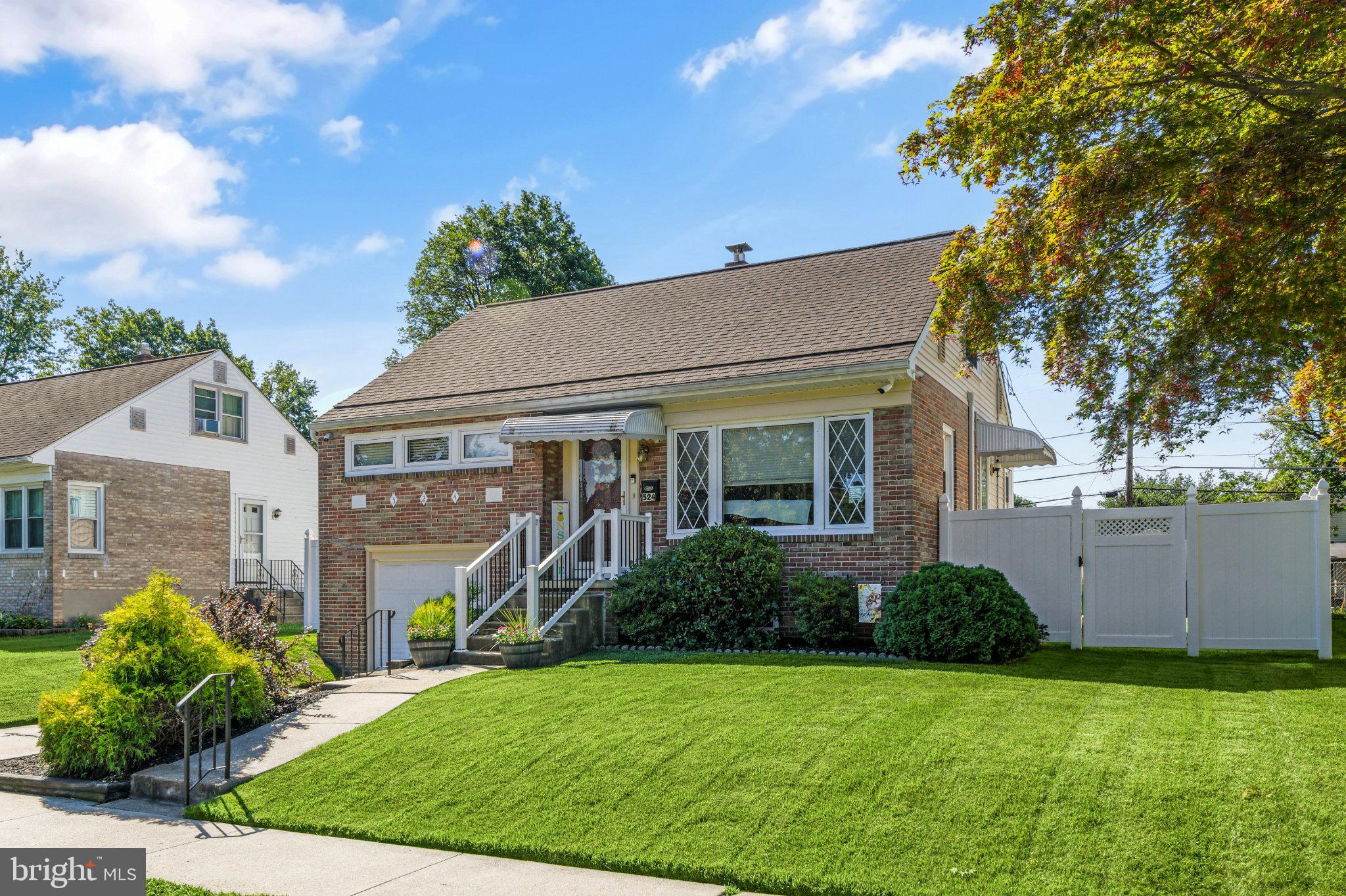 524 Harding Avenue Shillington, PA 19607 - Photo 33 of 37 Charming brick home with lush greenery.